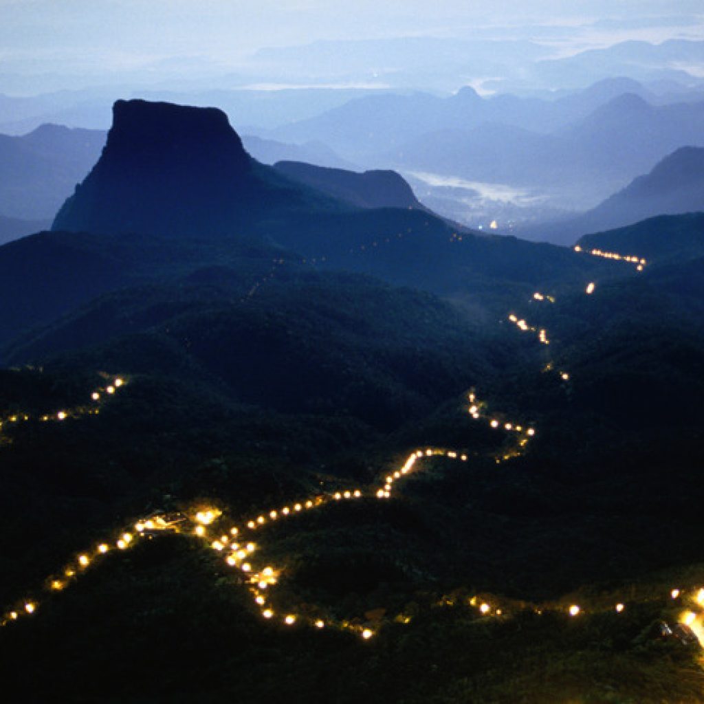 A long line of lights illuminates the path to the summit of Adam's Peak during the Poya Festival,Central,Sri Lanka,Indian Subcontinent